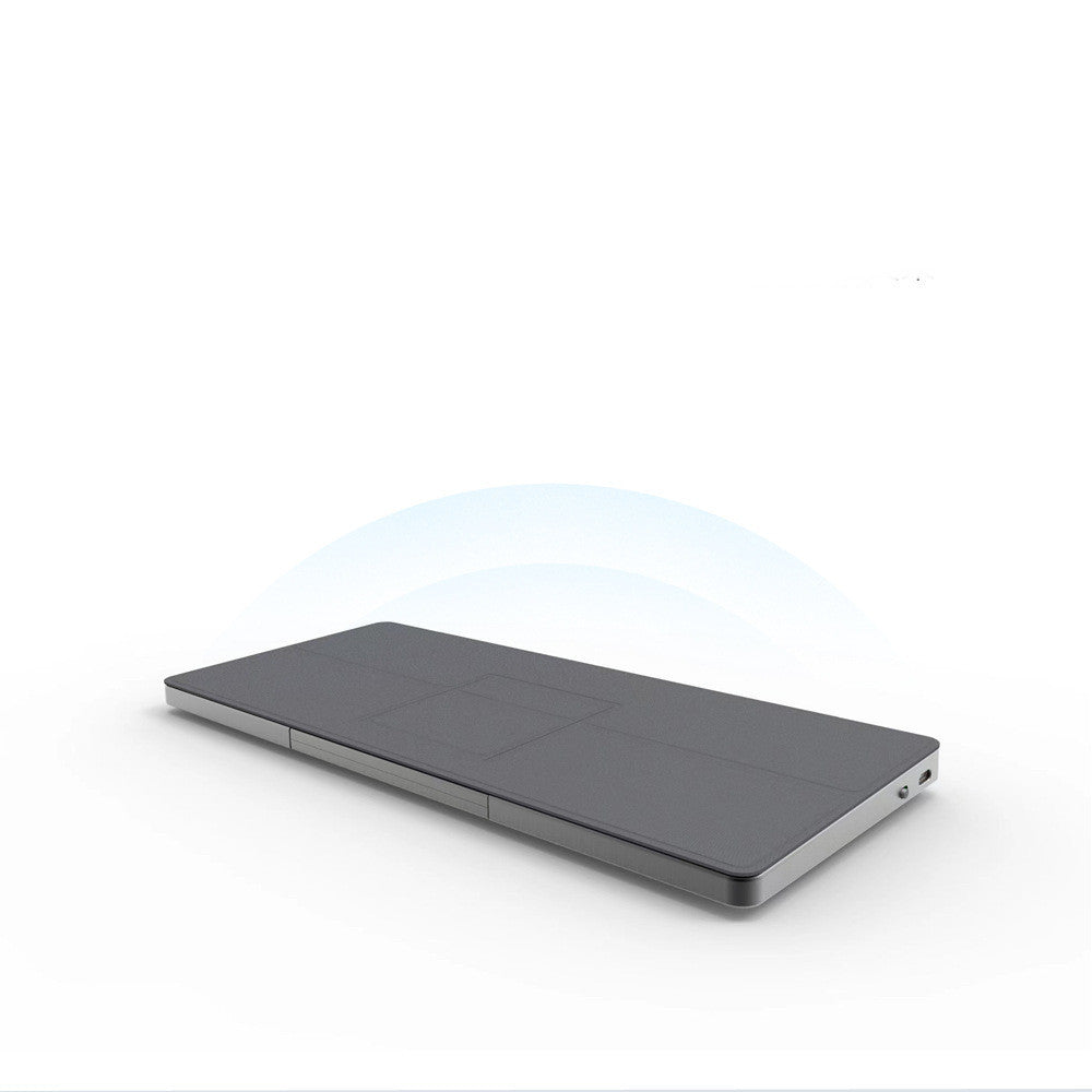 Portable wireless Bluetooth keyboard with built-in concealable touchpad, compact and sleek design for mobile and desktop use