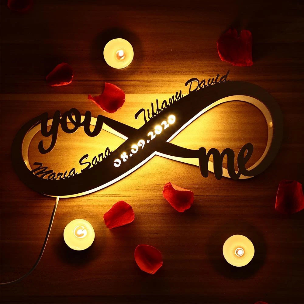 Handcrafted wooden lamp with lovers’ names and infinity sign, ideal for anniversaries
